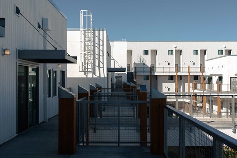 a view of a building with stairs and a fence