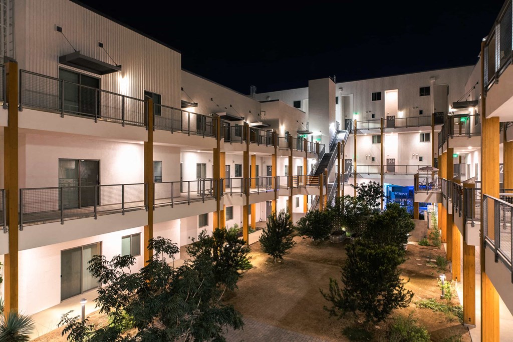 the courtyard of a resort at night