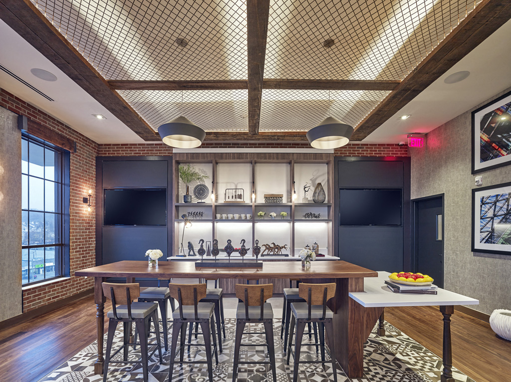 a dining room with a table and chairs and a bar