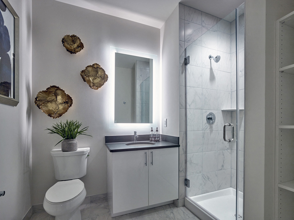 a small bathroom with a toilet sink and shower