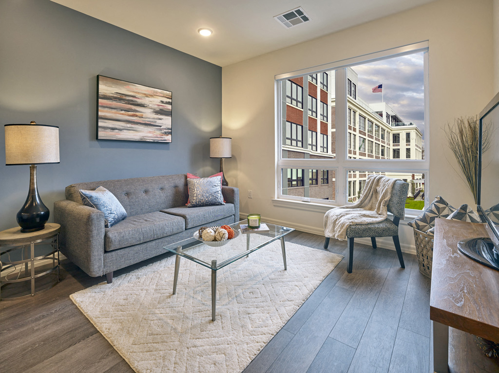 a living room with a couch and a large window