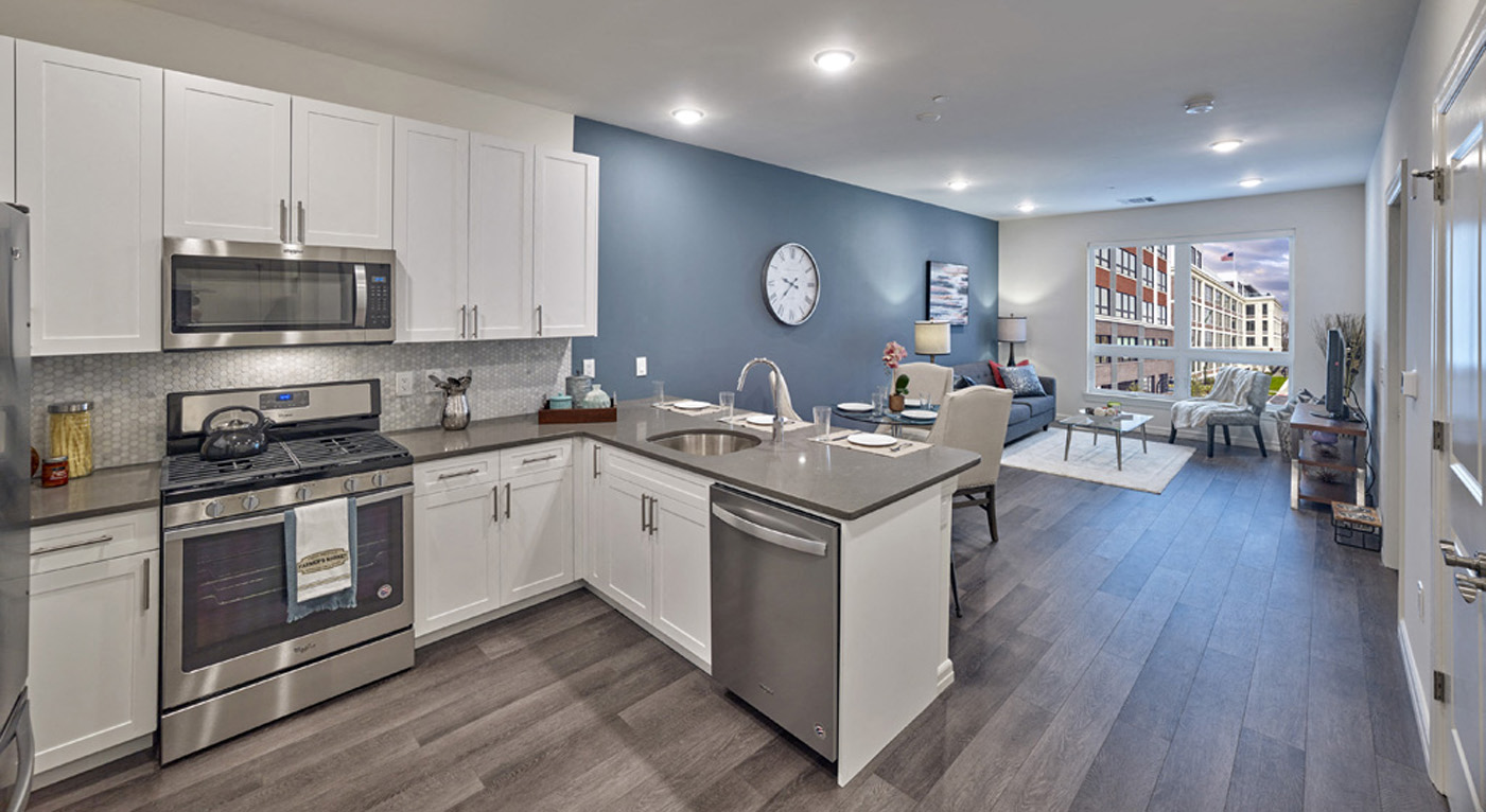 a kitchen with stainless steel appliances and a counter top