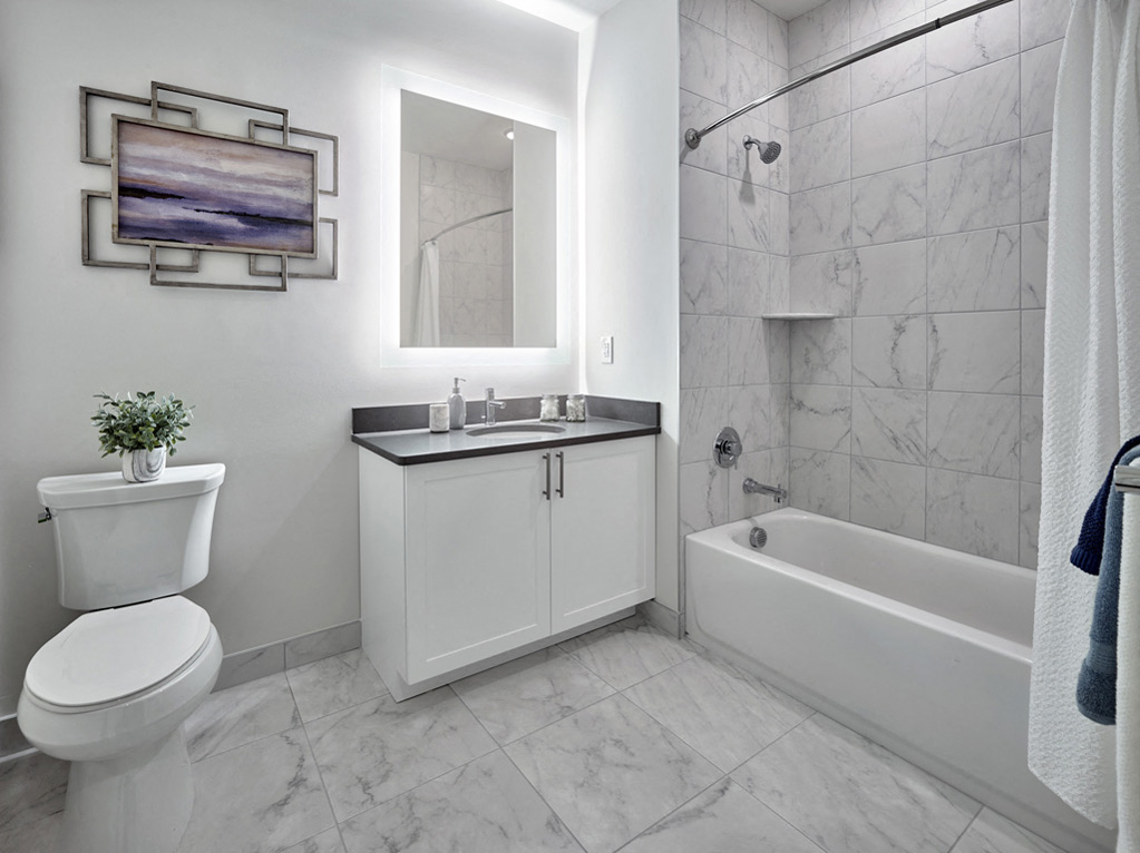 a bathroom with a sink toilet and a bath tub