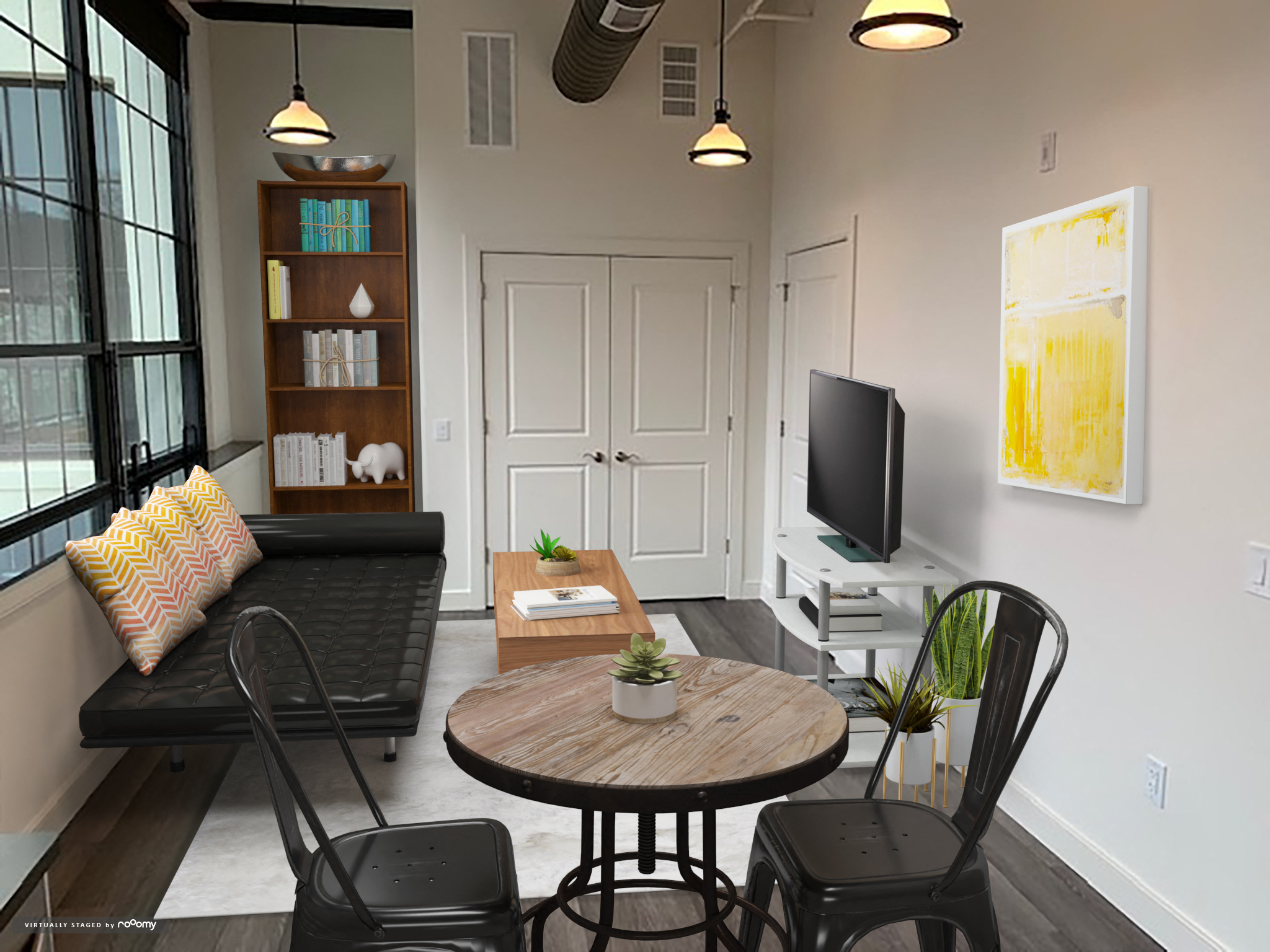 a living room with a table and chairs and a television