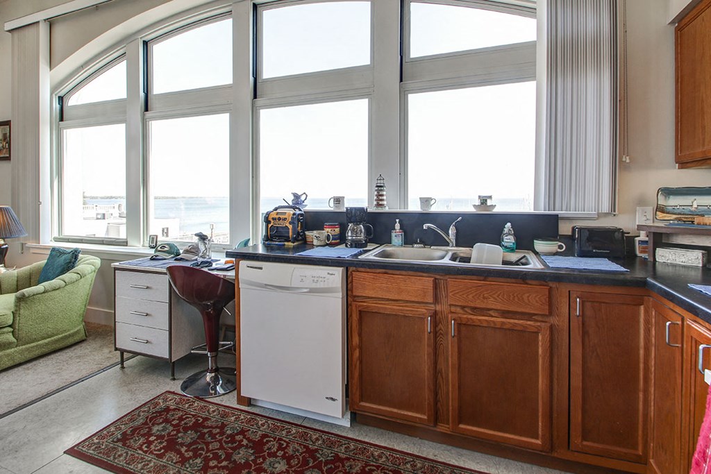 a kitchen with a sink and a window
