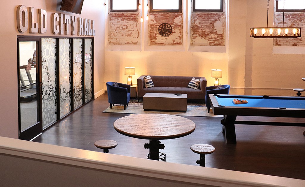 the lobby of old city hall with a pool table