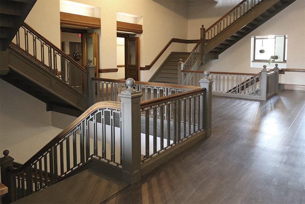 a view of a staircase in a house with a wood floor