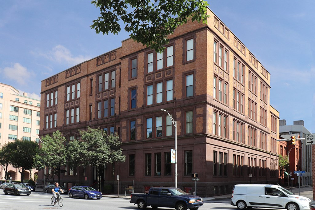 a large brick building on a busy city street