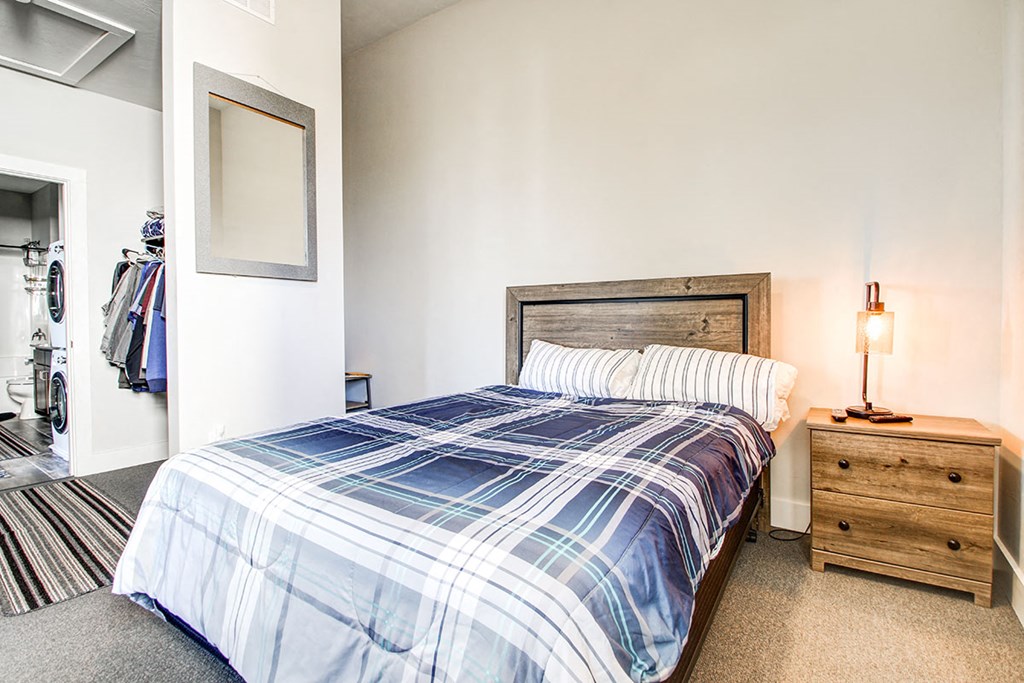 a bedroom with a bed and a closet