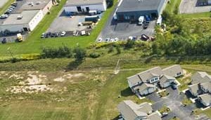 an aerial view of a neighborhood with houses and roads