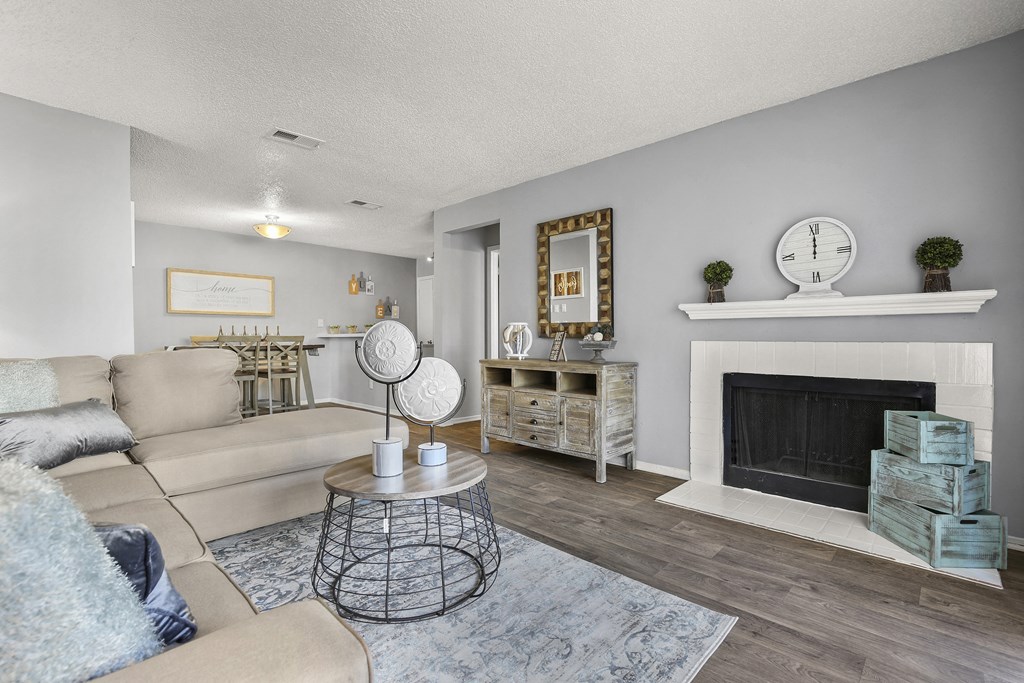 a living room with a couch and a fireplace