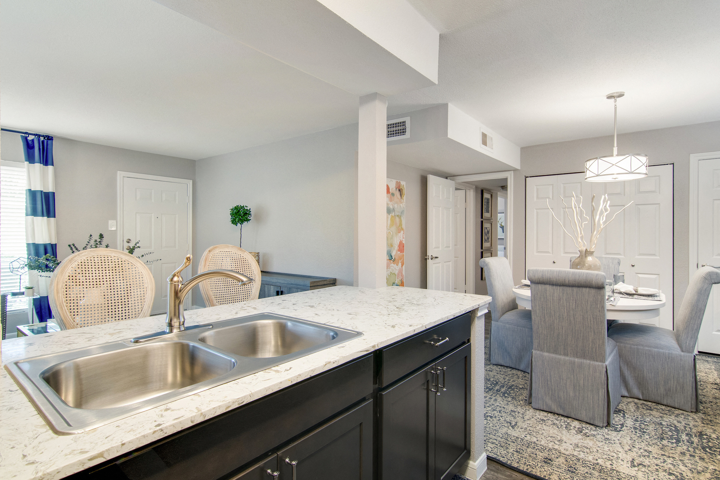 Kitchen With View of Dining Room at The Village at Bunker Hill in Houston, Texas