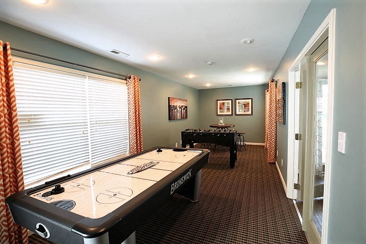 a game room with a ping pong table