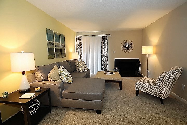 a living room with a couch and a chair