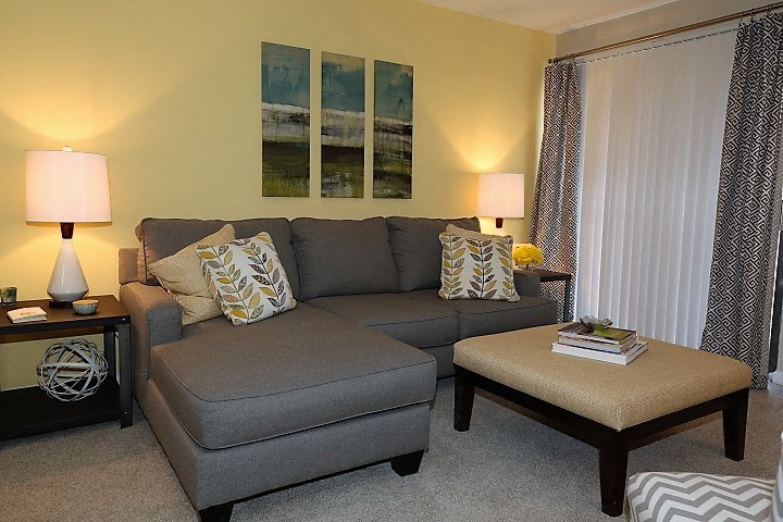 a living room with a couch and a table