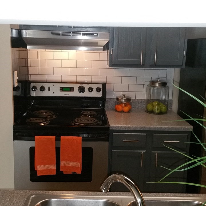 a kitchen with a stove and a sink