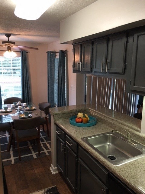 a kitchen with a sink and a table