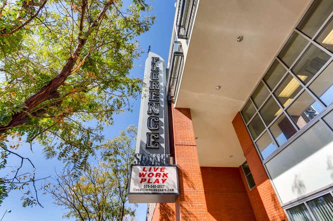 a live work play sign on the side of a building
