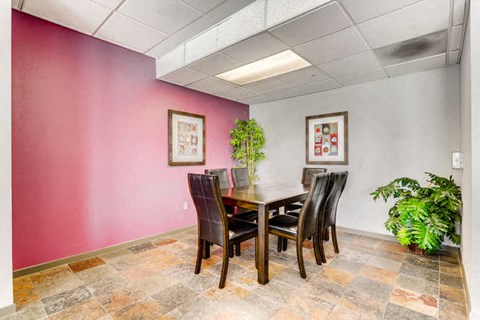a dining room with a table and chairs