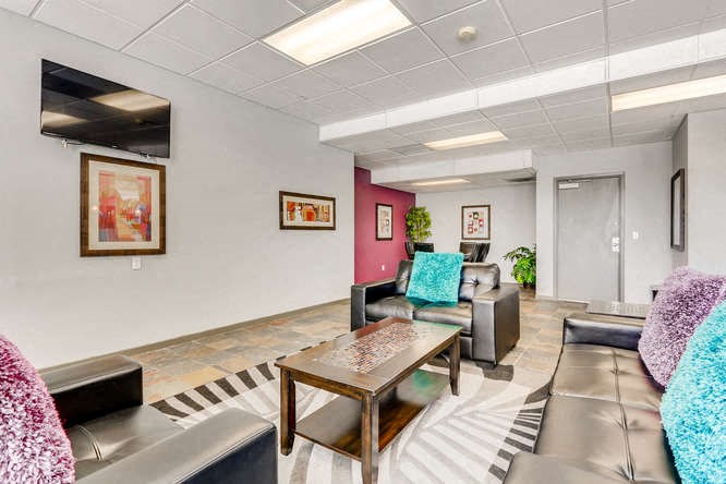 a living room with couches and a table