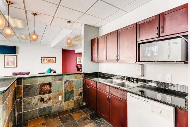 a kitchen with a sink and a counter top