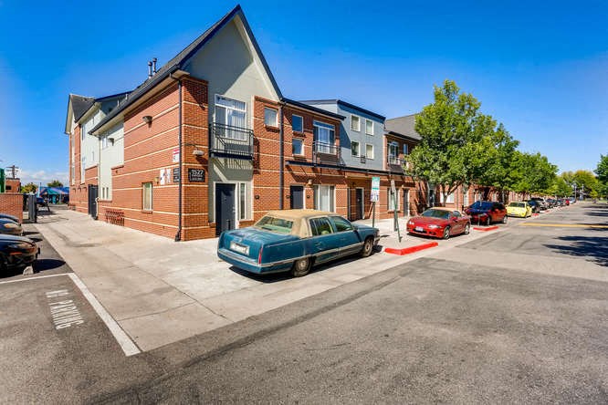 a row of houses on the side of a street
