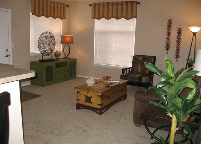 a living room with a couch and a table