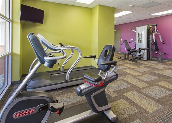 a gym with some exercise equipment in it