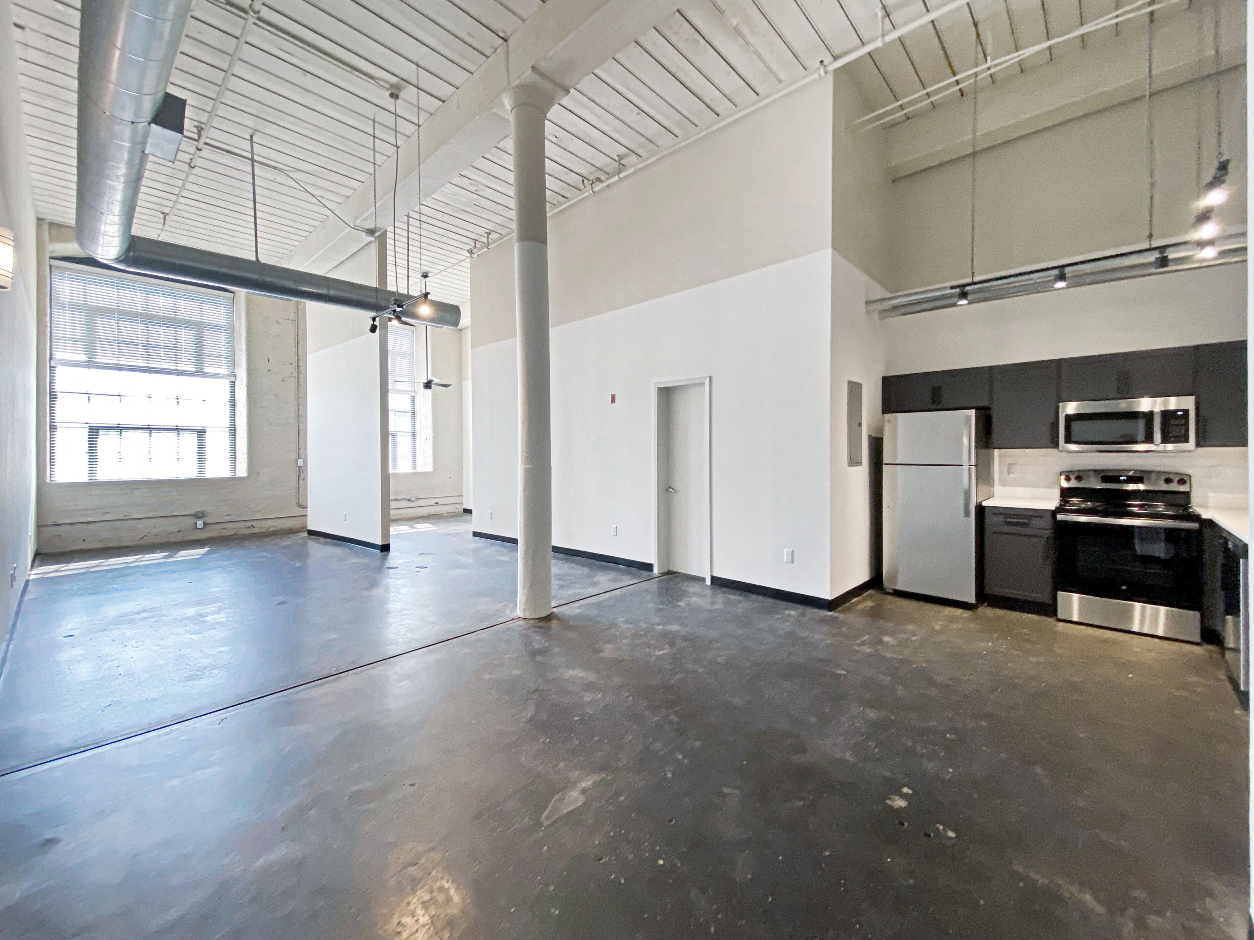 Open layout with Polished Concrete Floors and Tall Ceilings