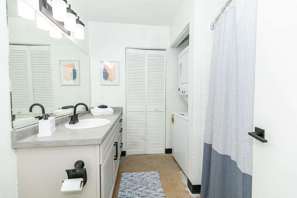 a bathroom with a sink and a shower