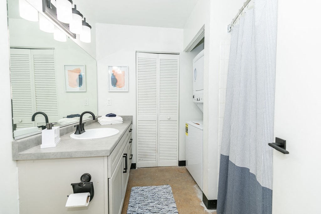 a bathroom with a sink and a shower