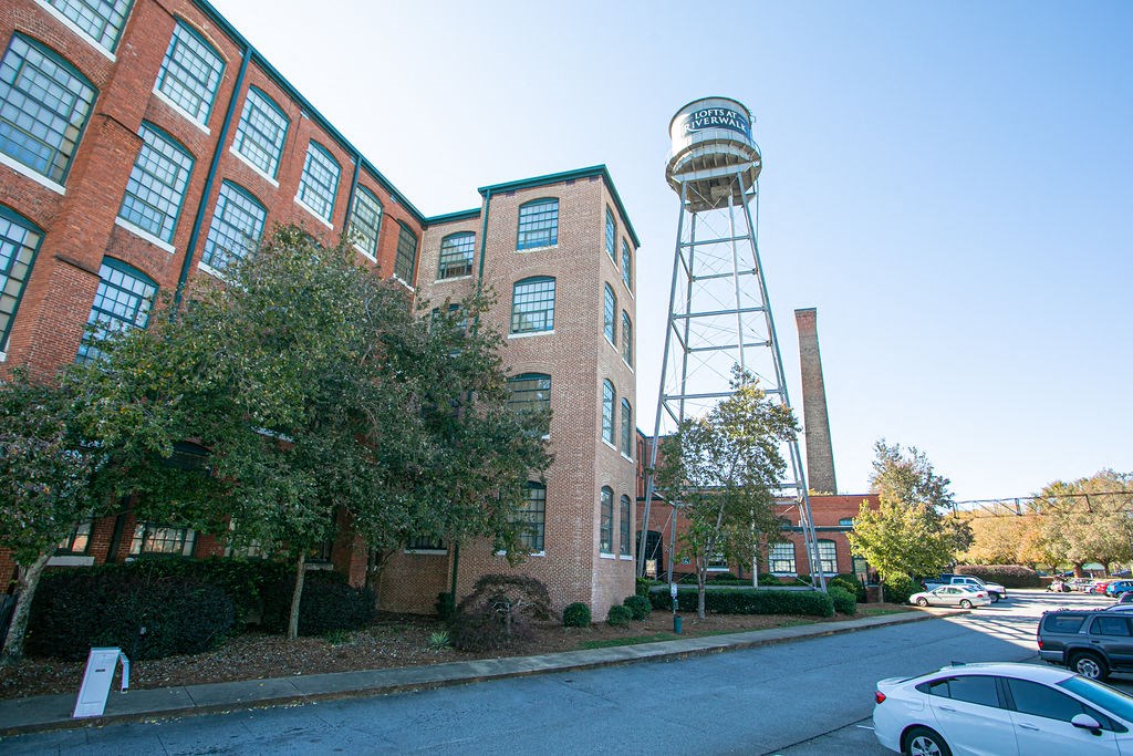 a building with a water tower in front of it