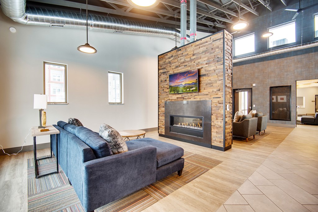 a living room with a couch and a fireplace