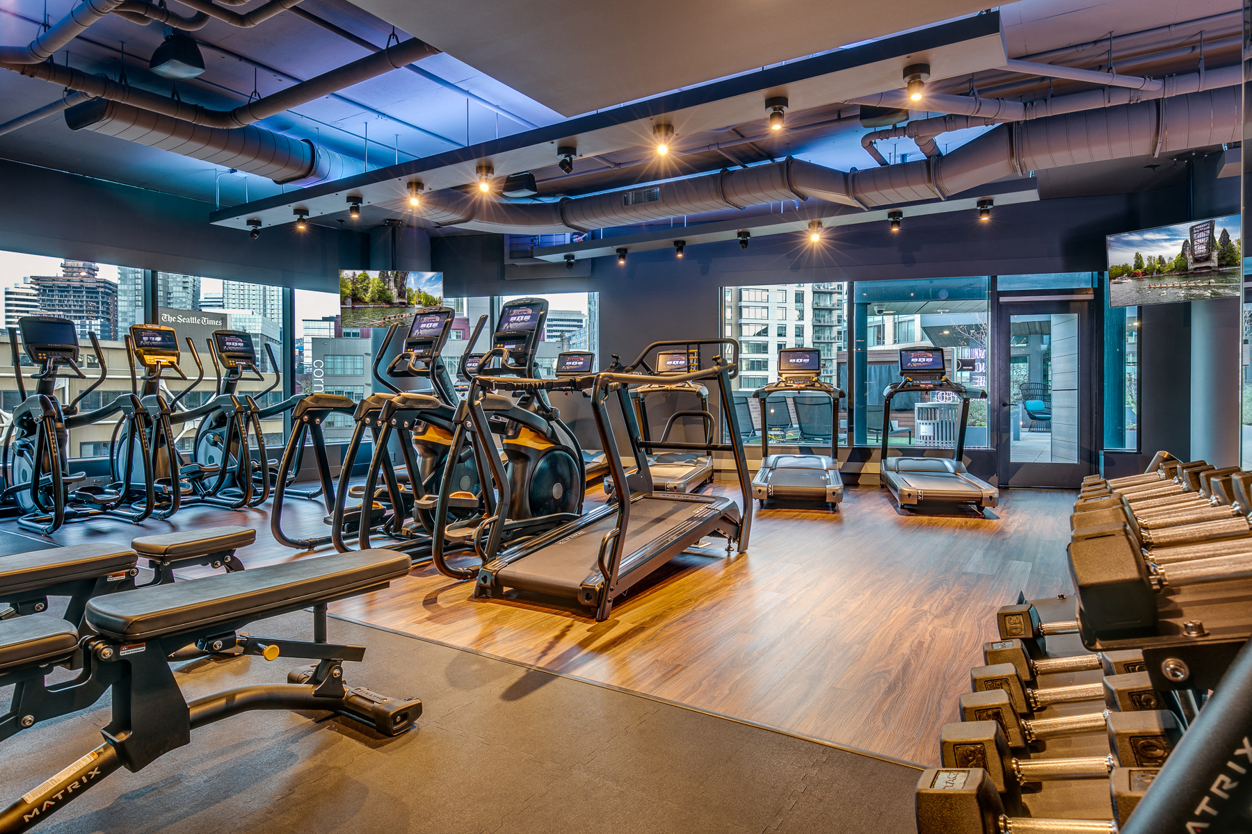 a gym with treadmills and other exercise equipment