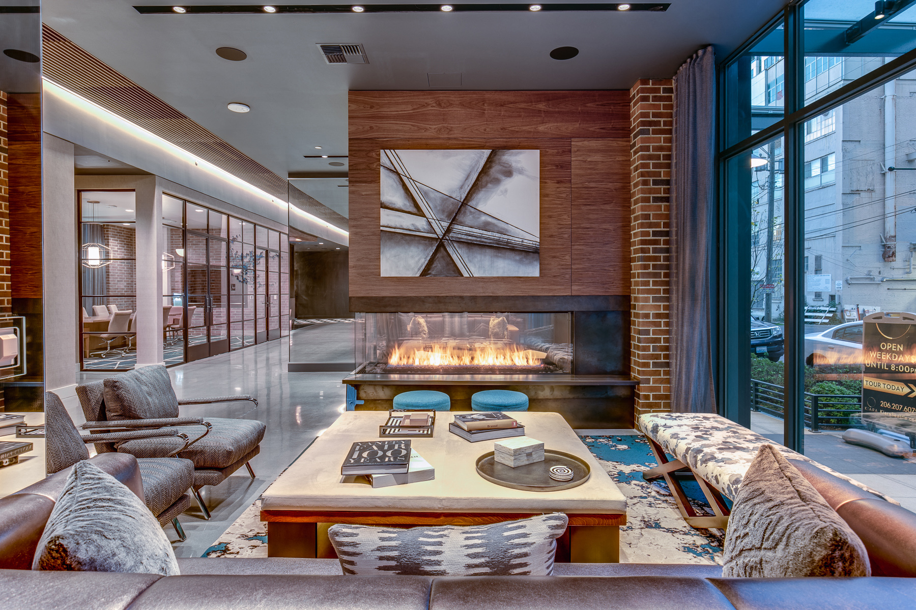 a living room with a fireplace and couches and a table