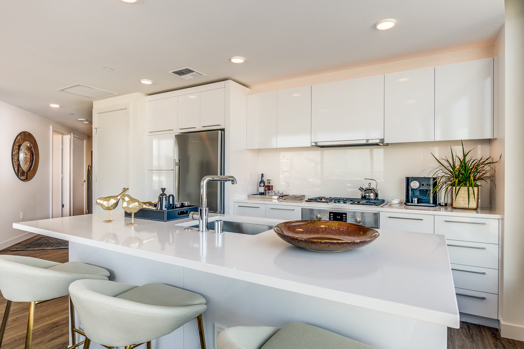 a kitchen with white cabinets and a white counter top