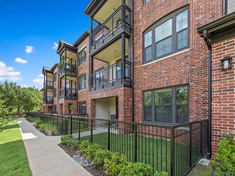 our apartments offer a spacious courtyard with a sidewalk and grass