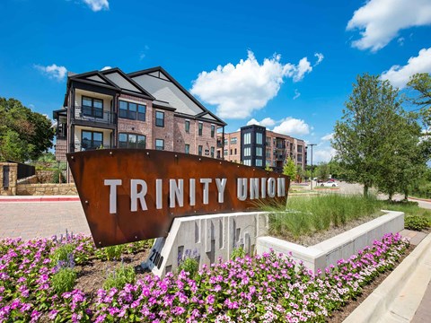 a sign for trinity union is in front of a building