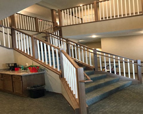 a staircase in a house with stairs and a counter