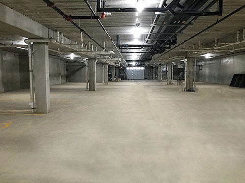 the inside of a building with a large empty parking garage