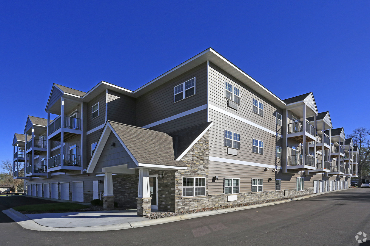 a large apartment building with a street in front of it