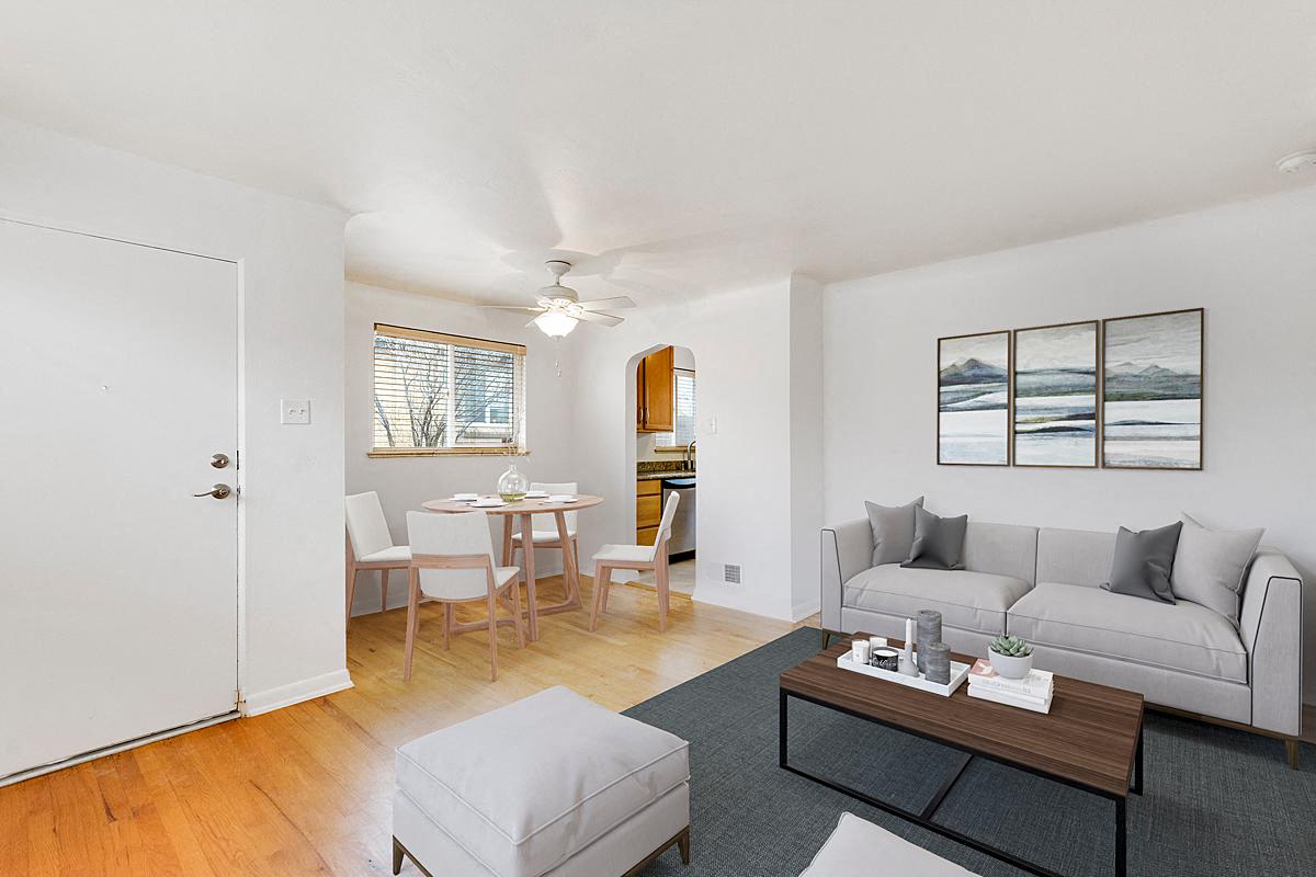 a living room and dining room with a couch and a table
