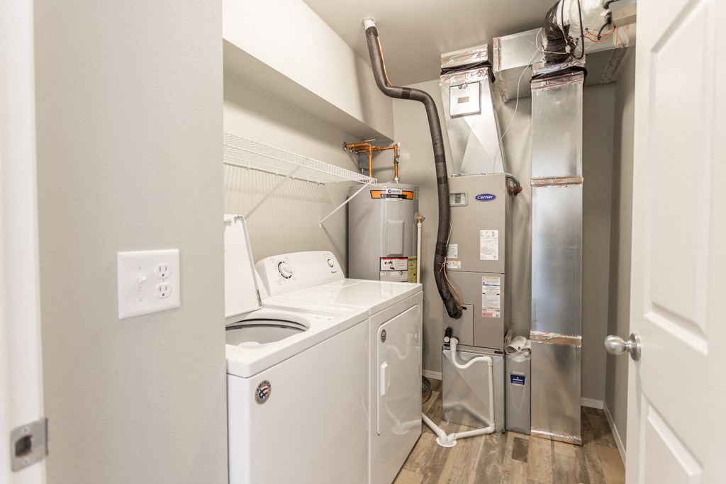 the laundry room has a washer and dryer and a refrigerator