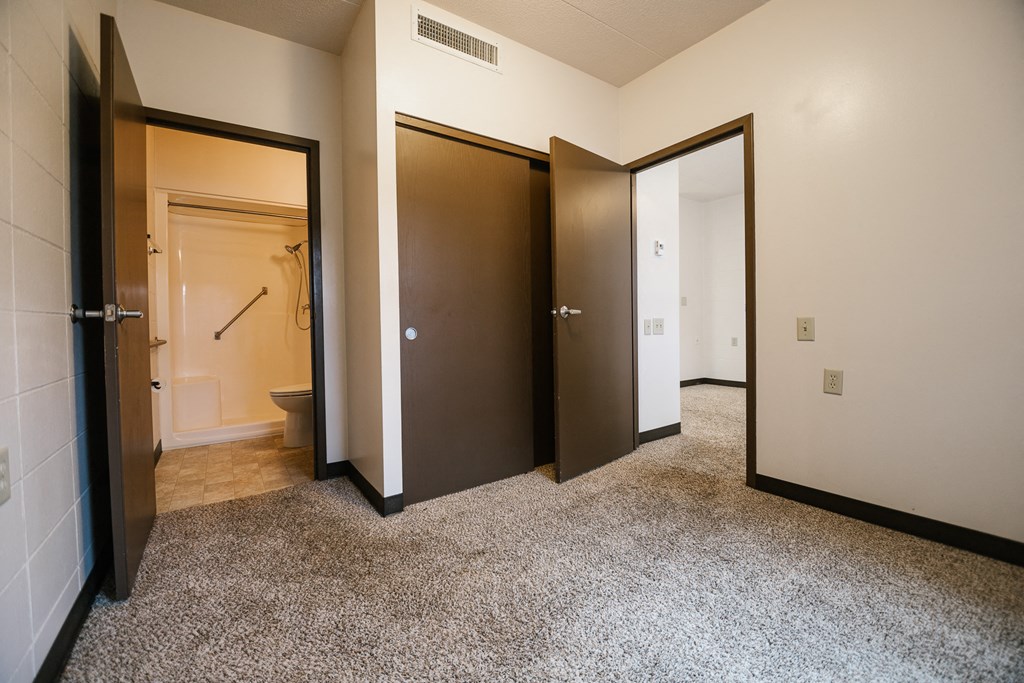 bedroom with view of closet