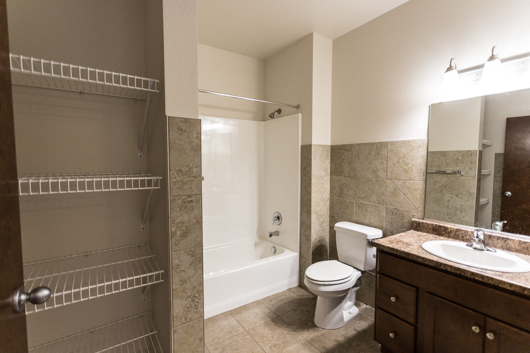 a bathroom with a shower toilet and sink