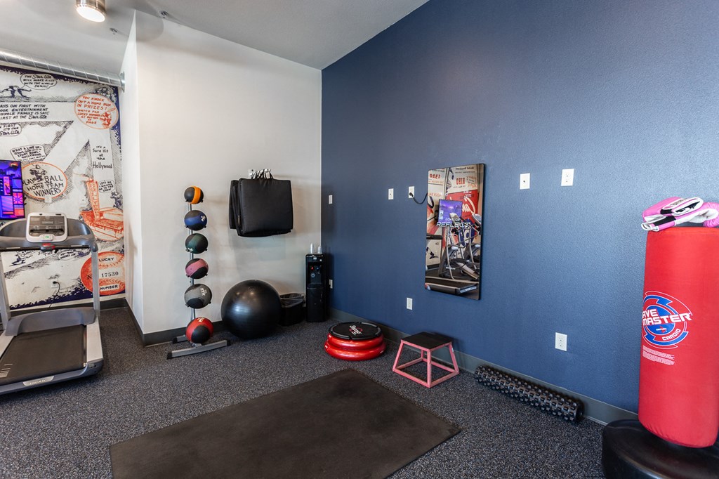 a workout room with a water bottle and exercise equipment