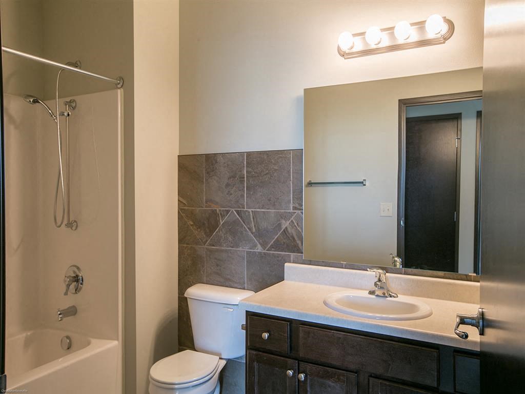 a bathroom with a sink toilet and a shower