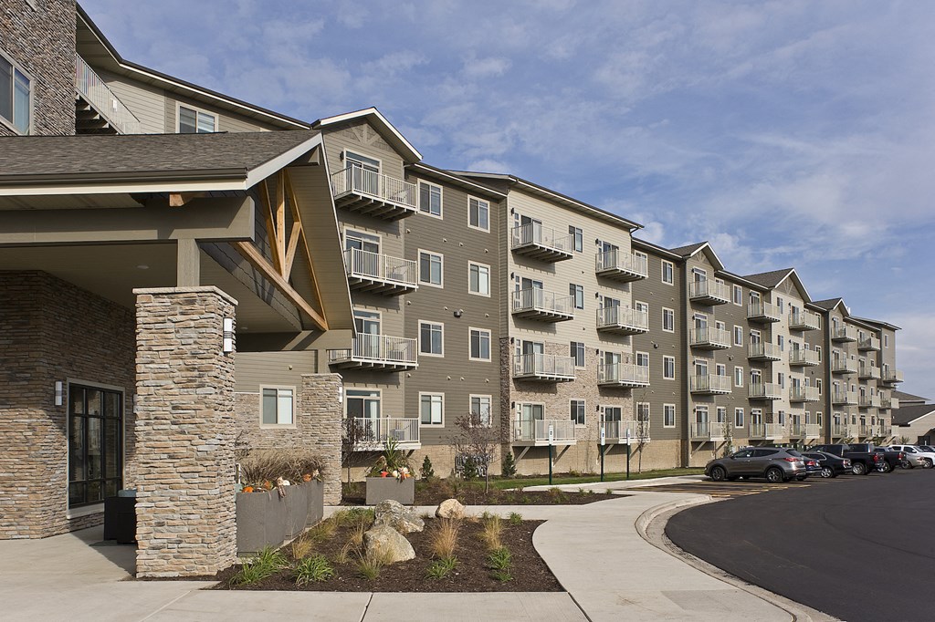 an apartment building on the corner of a street