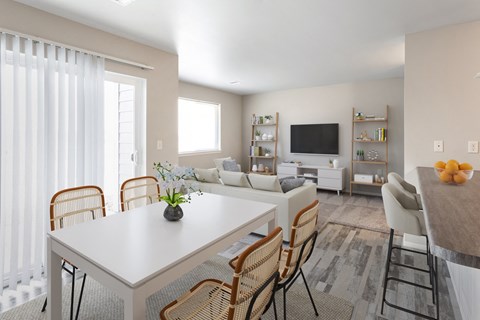 a dining room and living room with a white table and chairs