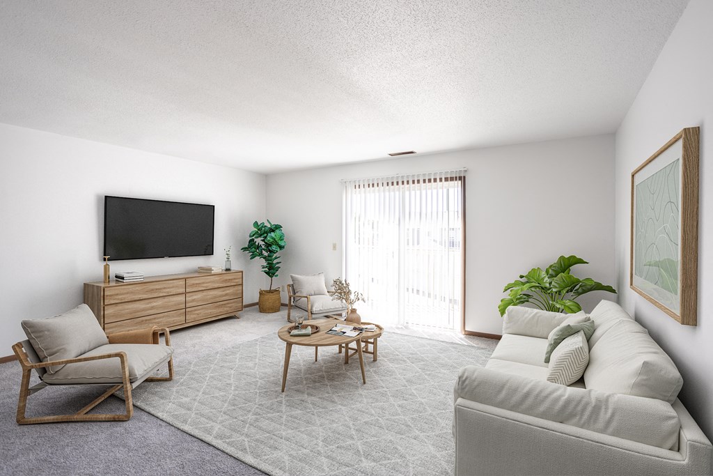 the living room of an apartment with a couch and a tv